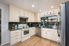 STUNNING HOME WITH SPA, FRONT AND BACK YARD, HUGE DECK, OUTSTANDING LOCATION