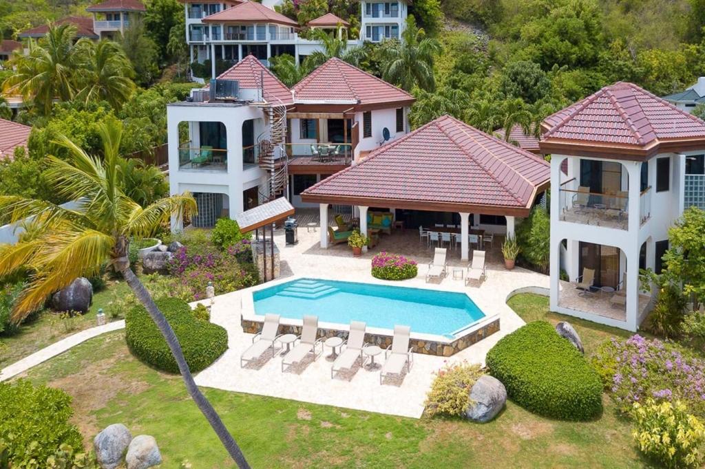 5 Bedrooms Oceanfront, Waterfront Villa rental with Private pool in Mahoe Bay, British Virgin Islands. Caribbean Wind