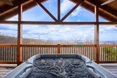 Enjoy the mountain views from the hot tub on the upper deck.