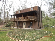 Six Bedroom Lakefront Log Home With A Dock Slip On Deep Creek Lake.