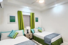 Bedroom 3, 2 Full/Double size beds, AC, ceiling fan, TV, USB charger lamp, ensuite bathroom, closet