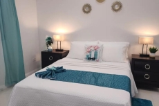 Bedroom 2, queen size bed, AC, ceiling fan, TV, ensuite bathroom, closet