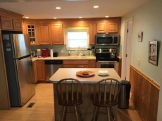 5 bedrooms, two golf carts, 4 bathrooms, linens ,post stay cleaning included