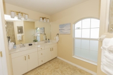 Primary bathroom features double sinks, private lav.