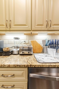 Sleek kitchen w/ modern cabinets & ample counter space for easy meals.