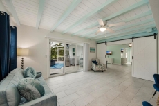 Barn doors lead into master bedroom and sitting area