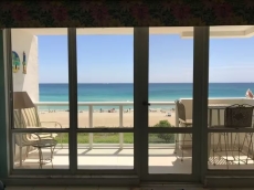 View of balcony and beach from living room.