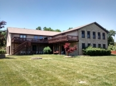 Lake Diane Luxury Estate on 2 acres with Indoor Pool, large family friendly, beautiful sand beach on 300ft shore, Large Pavilion, Firepit, 2 docks, kayaks, Paddle boat, Pontoon, Jetskies.   