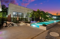 POOL AND LOUNGING AREA WITH VIEW OF MAIN HOUSE