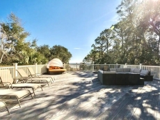 Rooftop deck comfortably seats 68 people to 8 round tables for parties/weddings