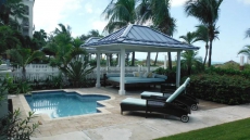 plunge pool for cooling off and lazy day bed for lounging around in front yard