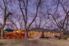 The new metal roof you are safe from any elements: one level open concept and big deck, lots of chairs.