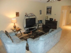 Sitting room with lots of comfortable seating and large screen TV