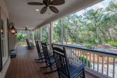A LOW COUNTRY-STYLE, WITH SOUTHERN PORCH, COMPLETE WITH CEILING FANS & ROCKERS.