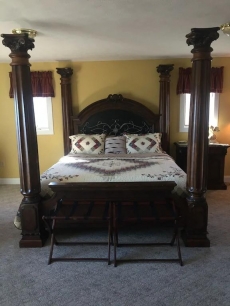 Sleep like a King in our massive four poster bed overlooking the valley