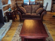 Spacious living and dining area in front of the fireplace with seating for 10