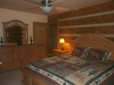 One of two master suites on the main floor has beautiful Broyhill furniture