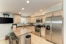 Beach Bliss. Blocks to the white sand beaches with a backyard oasis that