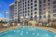 Outdoor Pool + Business Center, Free Breakfast | Fully Equipped Suite